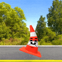 a red and white traffic cone with a face on it