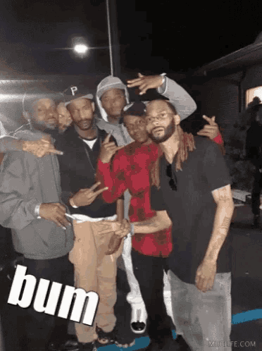 a group of young men posing for a picture with the word bum written on the bottom