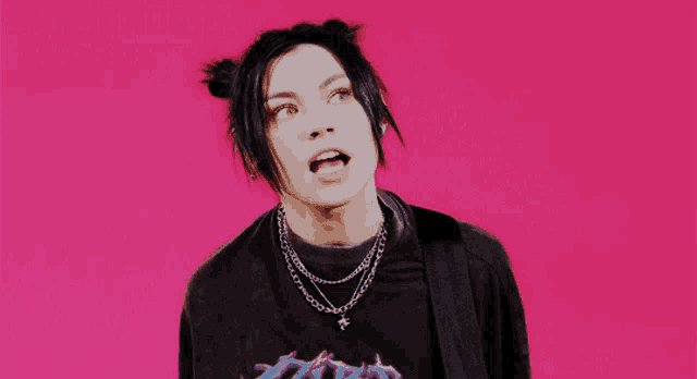 a person wearing a black t-shirt with a blue logo on it