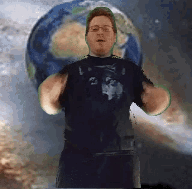 a man in a black shirt with a wolf on it stands in front of the earth