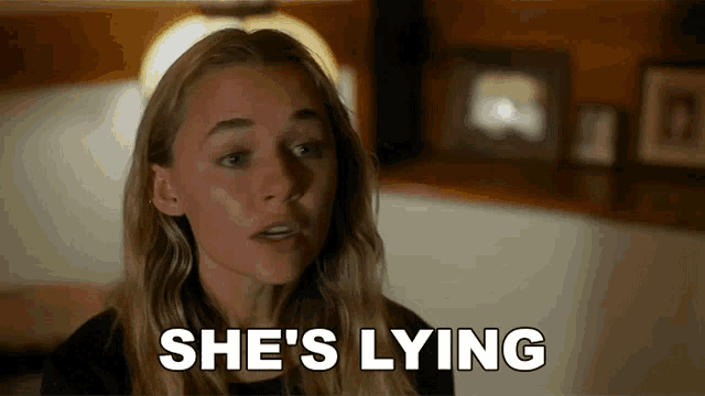 a woman says she 's lying next to a picture of her