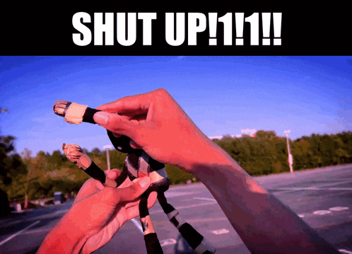 a picture of a person holding a stuffed animal with the words shut up111 on the bottom