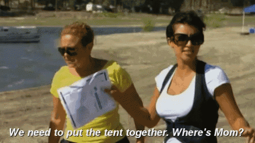 two women walking on a beach with the words " we need to put the tent together where 's mom "