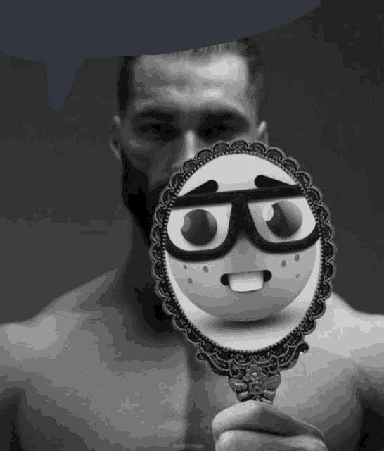 a man with a beard is holding a mirror with a face on it