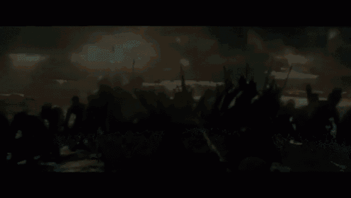 a group of soldiers with shields and spears in a battle scene