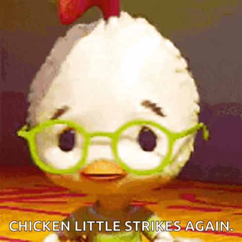 a cartoon chicken wearing green glasses is saying chicken little strikes again .