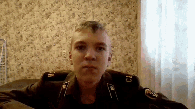 a young man in a military uniform has the letters ca on his shoulder