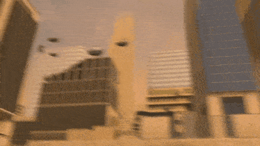 a group of helicopters flying over a city