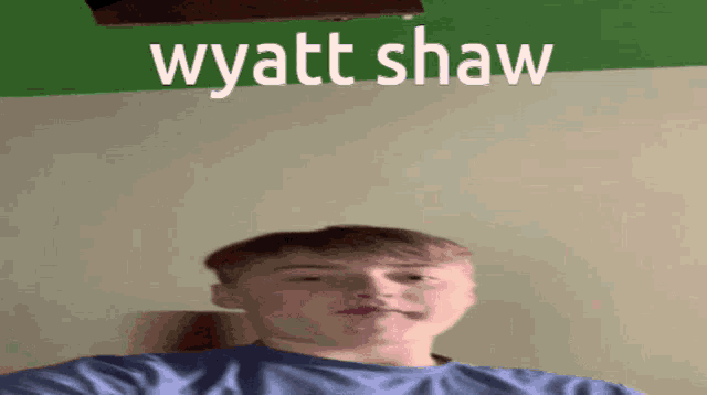 a young man taking a selfie with the name wyatt shaw on the bottom