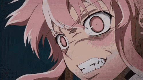 a close up of a girl with pink hair making a funny face .