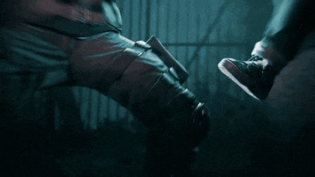 a man is holding a gun and another man is holding a gun
