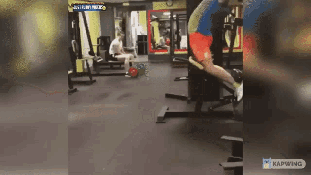 a man is doing exercises in a gym with a caption that says just funny video