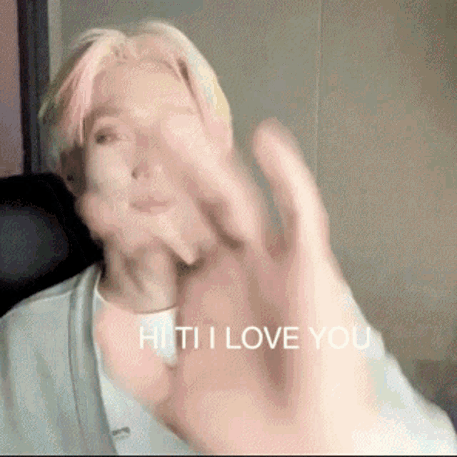 a blurred image of a person with the words " hi ti i love you "
