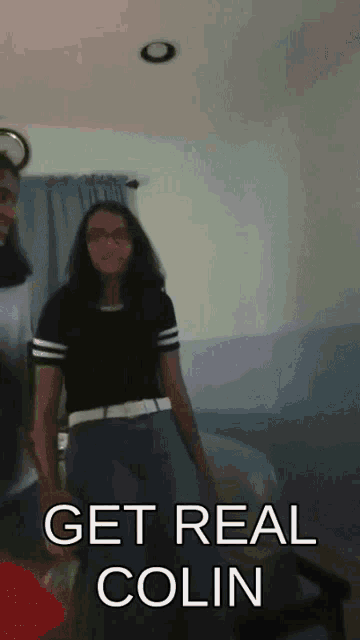 a girl standing in a room with the words " get real colin " written on the bottom