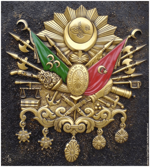 a gold emblem with a red green and white flag and the number 33