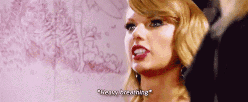 a close up of a woman 's face with the words `` heavy breathing '' on it .