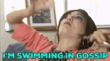 a woman is laying on a couch with the words i 'm swimming in gossip on the bottom