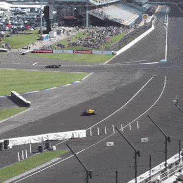 a red and white race car with smoke coming out of it 's tires