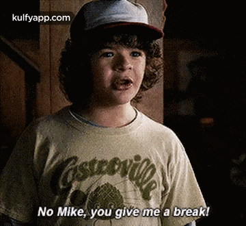 a young boy wearing a hat and a t-shirt is saying `` no mike , you give me a break '' .
