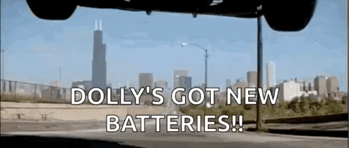 a car is flying through the air with the words dolly 's got new batteries written on the bottom