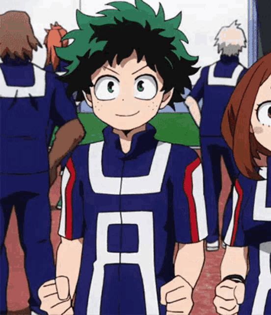 a boy in a blue shirt with the letter u on it