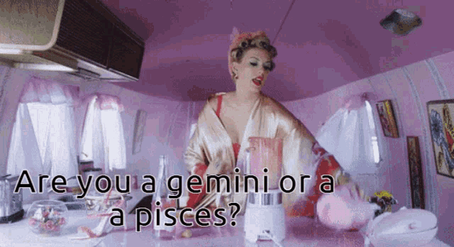 a woman in a bathrobe is holding a blender in a pink room and the words are you a gemini or a pisces