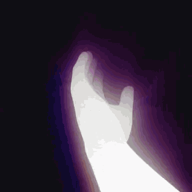a white hand is reaching out in the dark with a purple background