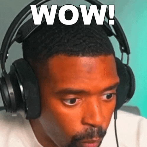 a man wearing headphones with the word wow written on his face