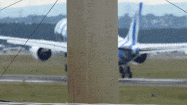 a plane is taking off from a runway and the word regie is visible