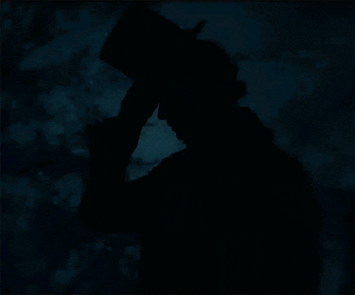 a silhouette of a man in a top hat