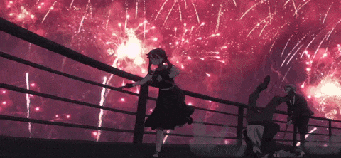 a girl in a black dress is standing on a railing watching fireworks