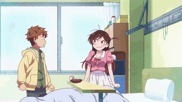 a boy and a girl standing next to each other in a bedroom