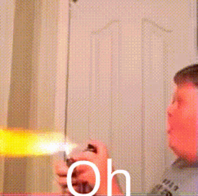 a man is holding a lighter and the word no is on the bottom