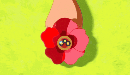 a girl with a red flower in her hair has the letter s on her ear