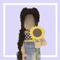 a girl is holding a sunflower in her hands .