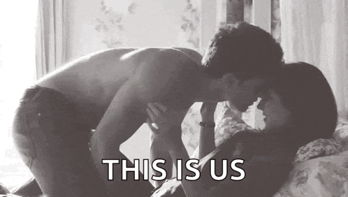 a man and a woman are kissing on a bed in a black and white photo with the words `` this is us '' .