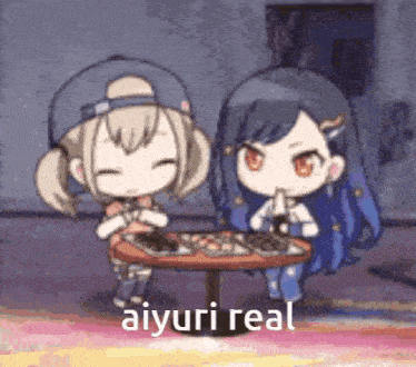a couple of anime girls sitting at a table with a caption that says aiuri real .