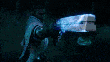 a man in a white cape is holding a sword that is glowing in the dark