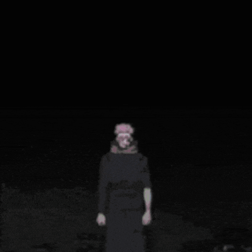 a silhouette of a person in a black coat standing in the snow