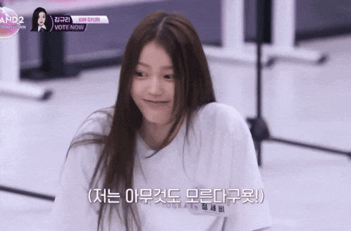 a girl wearing a white shirt that says vote now on it