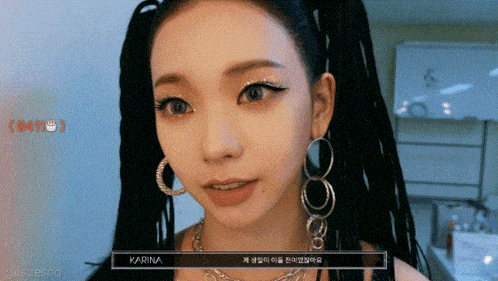 a close up of a woman 's face with the name karina on the bottom right