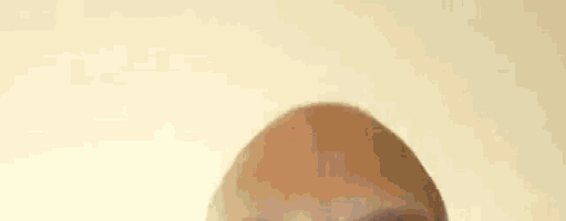 a close up of a man 's head with glasses on .