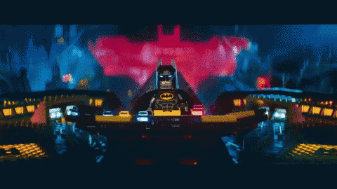 a pixelated image of a lego batman in front of a red bat symbol