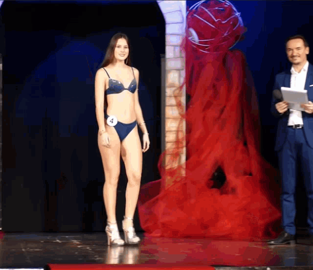 a woman in a bikini with the number 4 on her waist