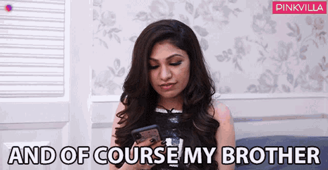 a woman looking at her phone with the words " and of course my brother " behind her