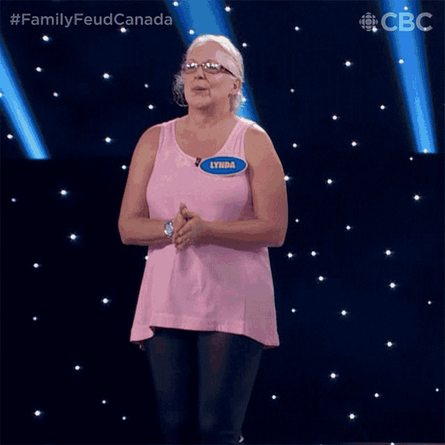 a woman in a pink tank top with the name lynda on it
