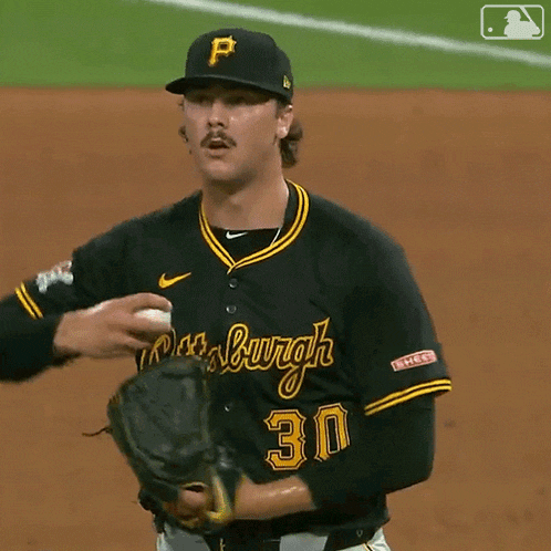 a baseball player wearing a black jersey that says burgh on it