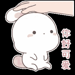 a hand is petting the head of a bunny rabbit .