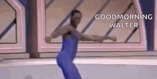 a man in a blue leotard is dancing on a stage and saying `` good morning walter '' .