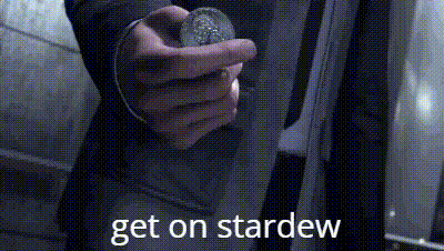 a person is holding a coin in their hand with the words `` get on stardew '' written on it .